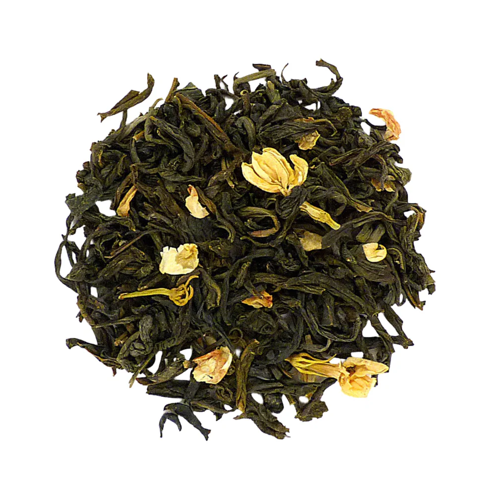 Loose jasmine green tea leaves with dried jasmine flower petals mixed in